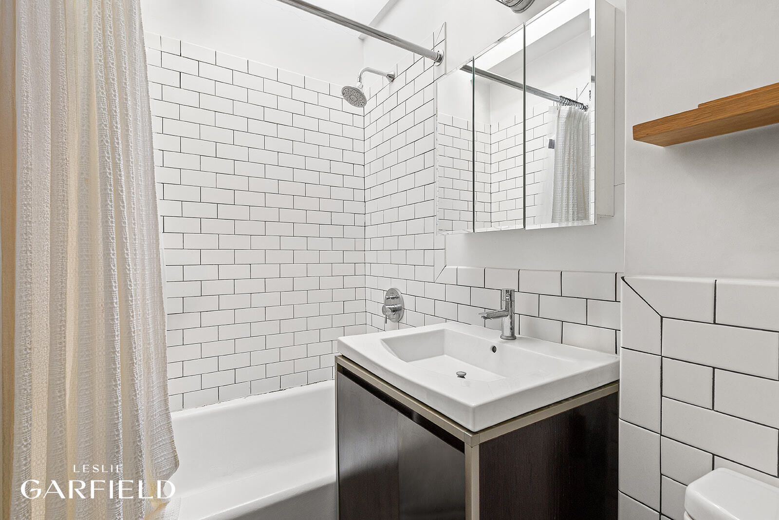 485 West 22nd Street Manhattan, NY 10011 - Photo 11 of 20 a bathroom with a sink and shower