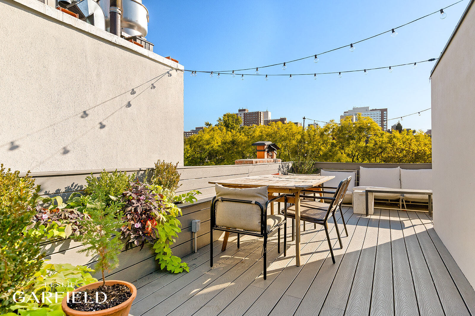 485 West 22nd Street Manhattan, NY 10011 - Photo 12 of 20 a patio with table and chairs and potted plants