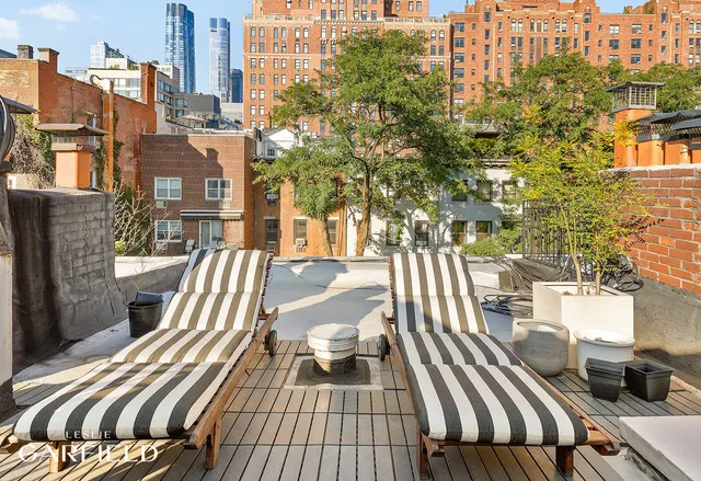 a view of balcony with wooden floor