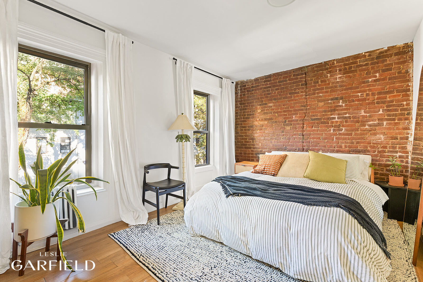 485 West 22nd Street Manhattan, NY 10011 - Photo 4 of 20 a bedroom with a bed and a window
