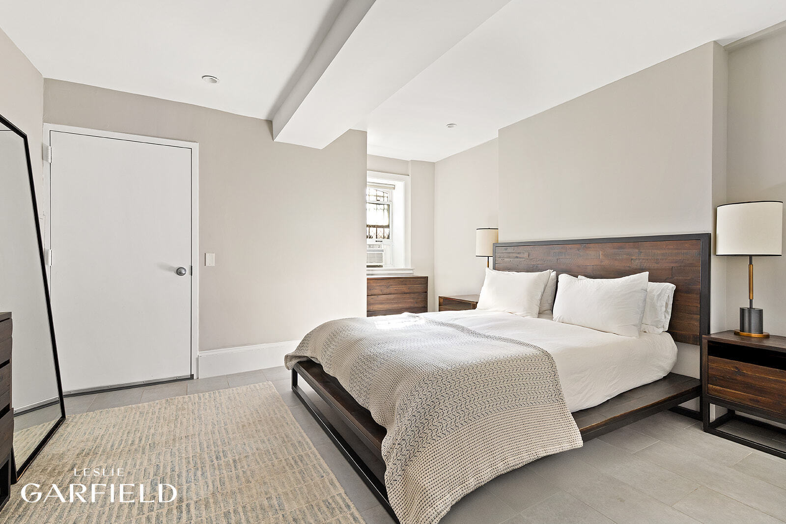 485 West 22nd Street Manhattan, NY 10011 - Photo 9 of 20 a bedroom with a bed and a night stand