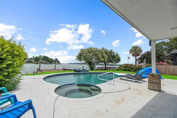 a view of a swimming pool with a patio