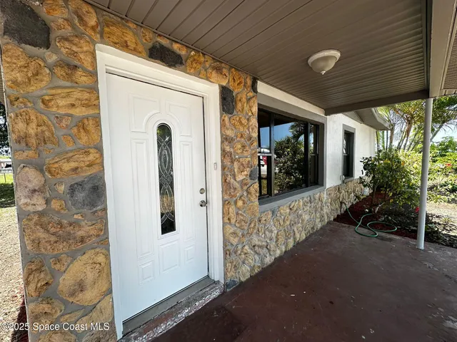 a front view of a house with a porch