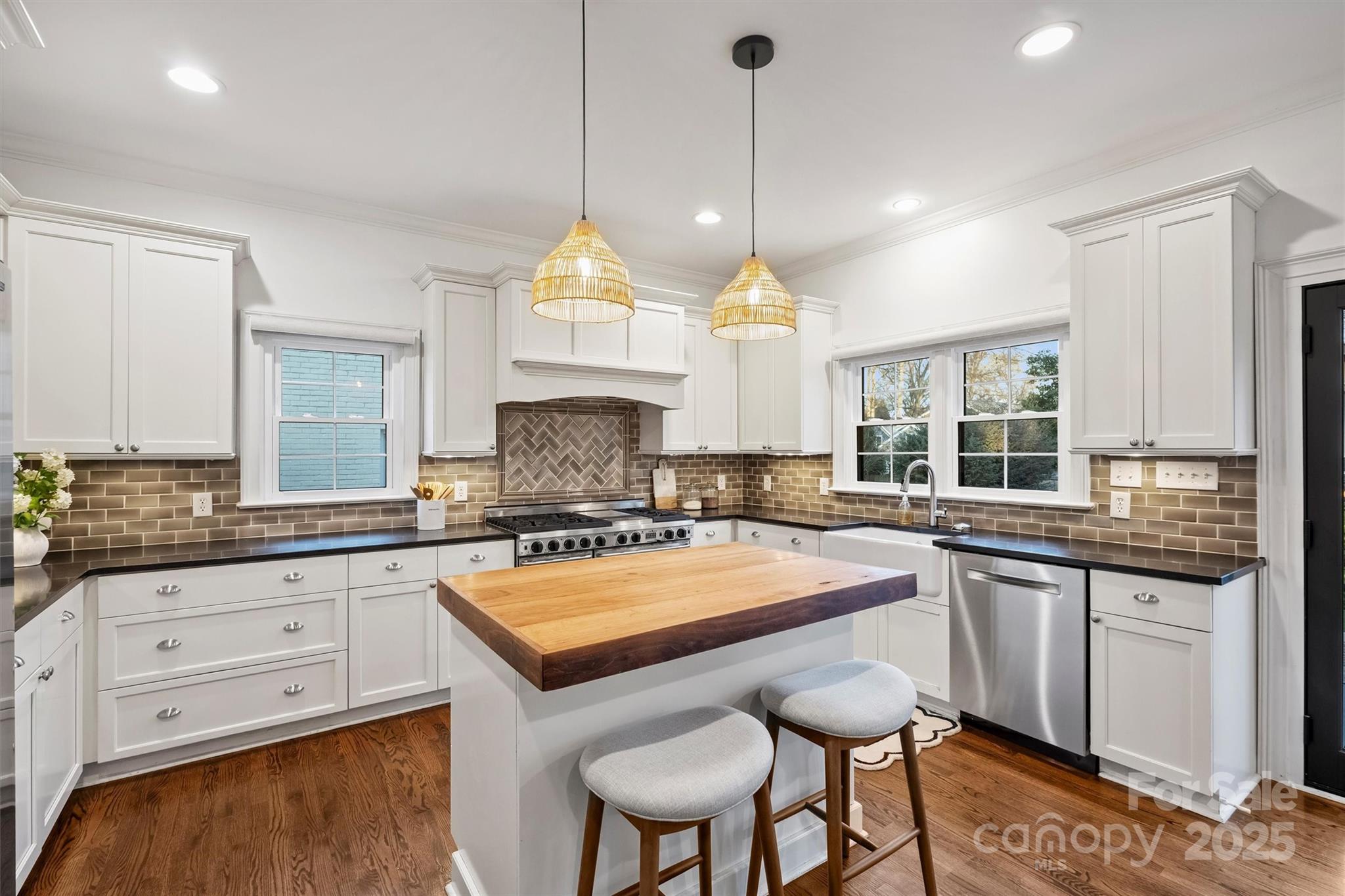 1914 Club Road Charlotte, NC 28205 - Photo 11 of 40 a kitchen with granite countertop a sink a center island and cabinets