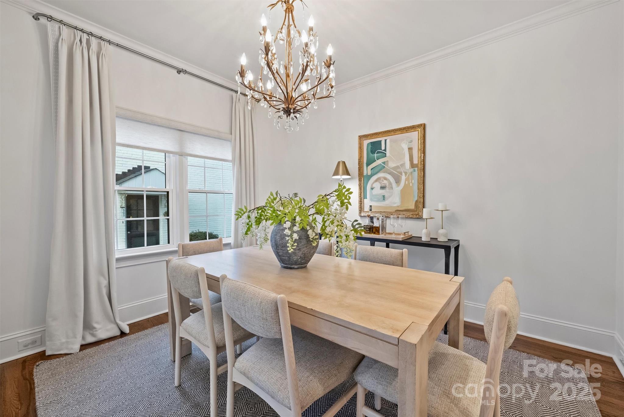 1914 Club Road Charlotte, NC 28205 - Photo 15 of 40 a dining room with furniture potted plants and wooden floor