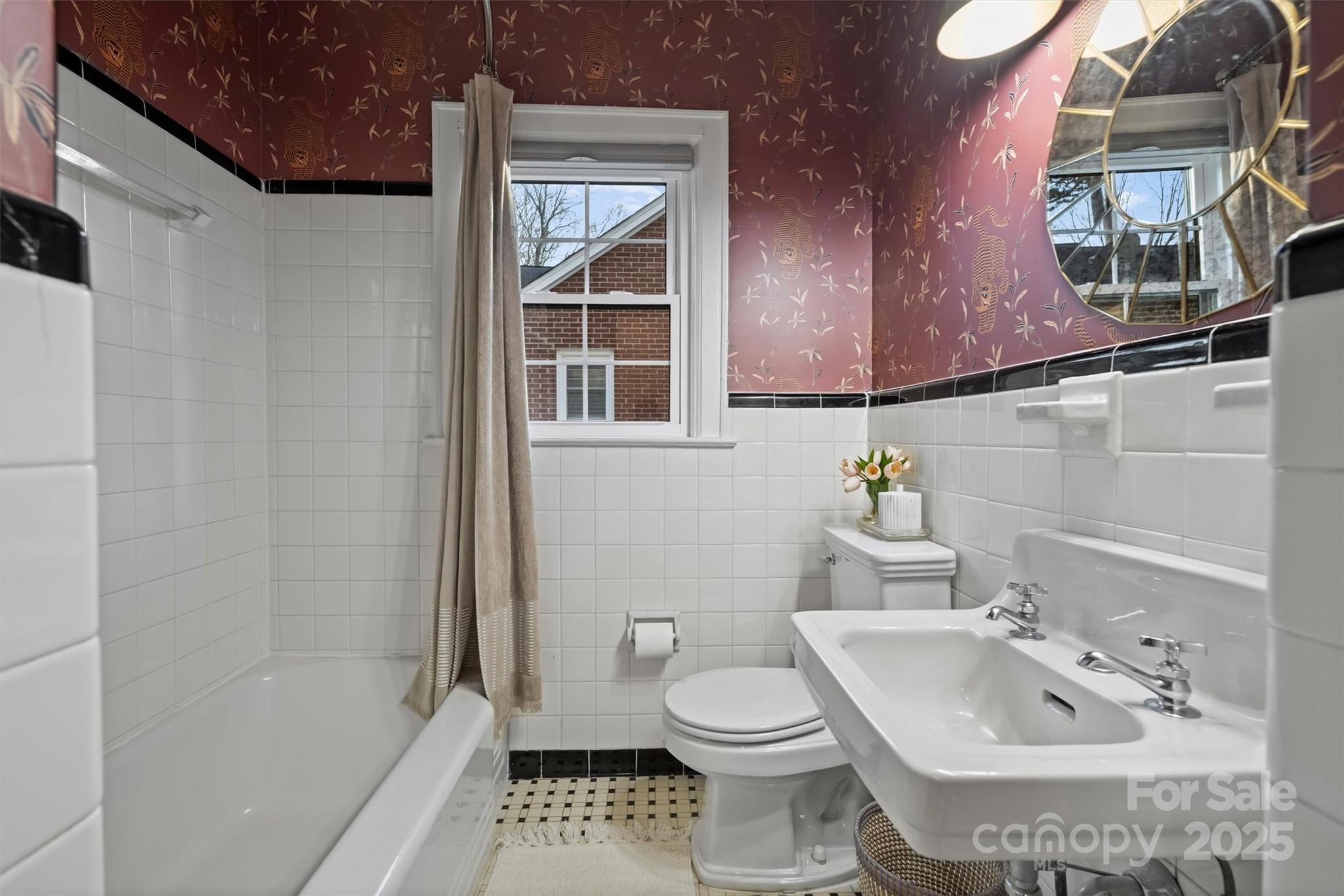 1914 Club Road Charlotte, NC 28205 - Photo 17 of 40 a bathroom with a sink toilet and shower