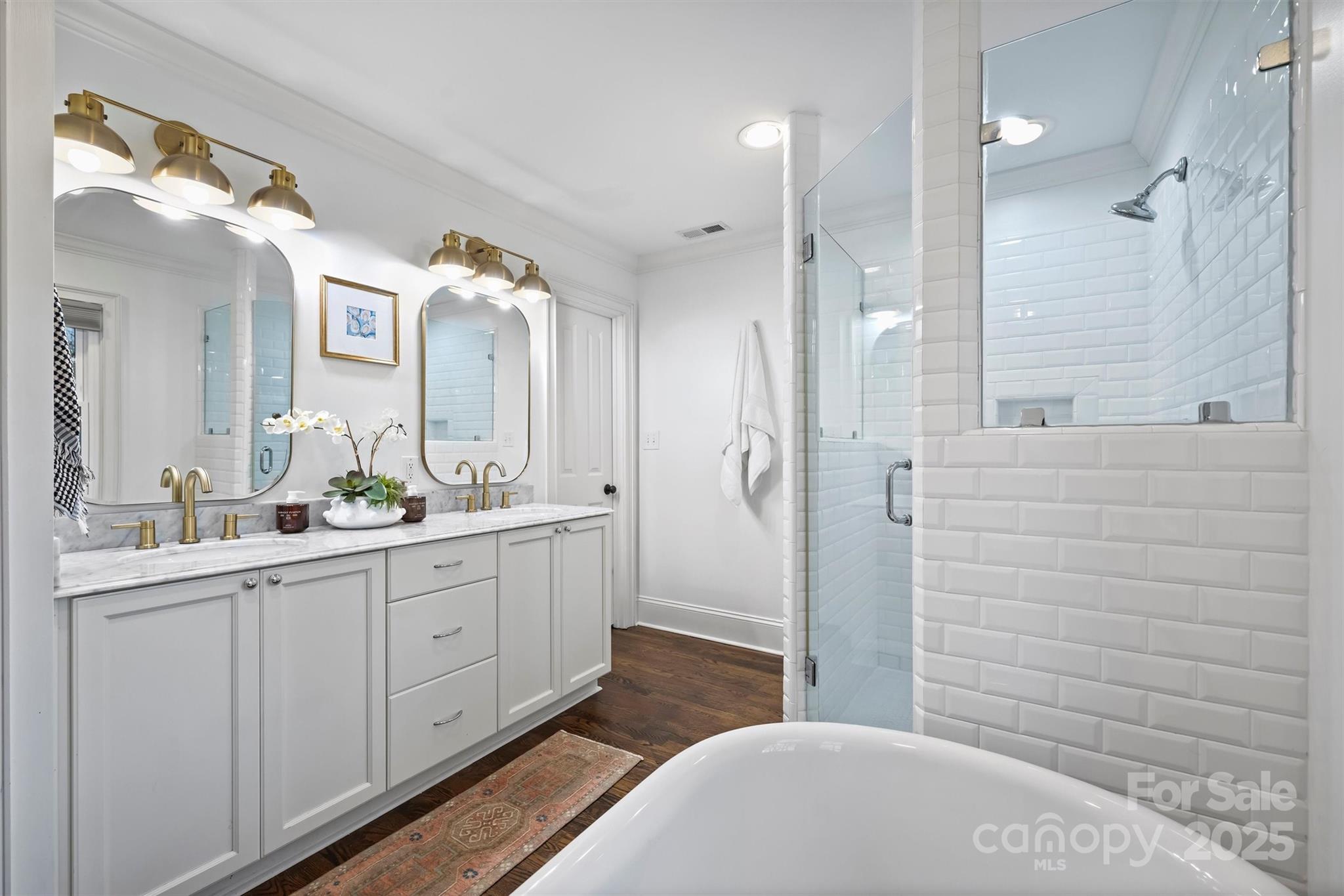 1914 Club Road Charlotte, NC 28205 - Photo 20 of 40 a bathroom with a double vanity sink and mirror