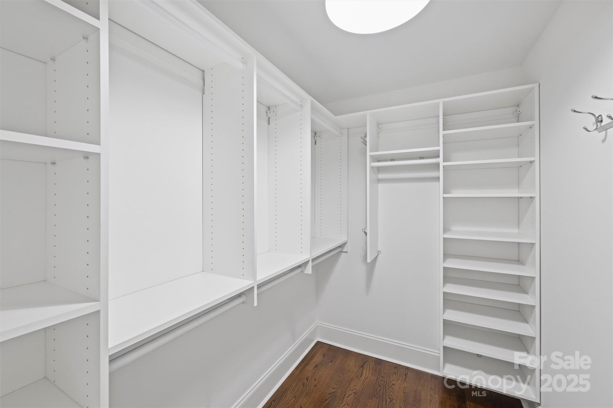 1914 Club Road Charlotte, NC 28205 - Photo 23 of 40 a view of walk in closet with empty racks