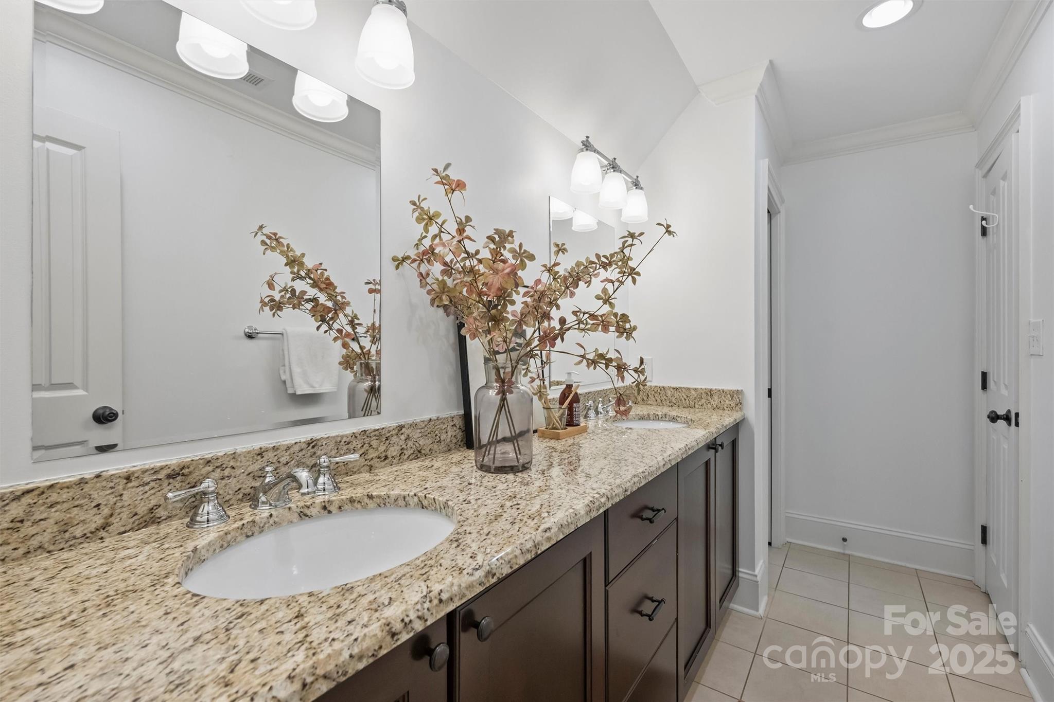 1914 Club Road Charlotte, NC 28205 - Photo 27 of 40 a bathroom with a granite countertop sink a mirror and a shower