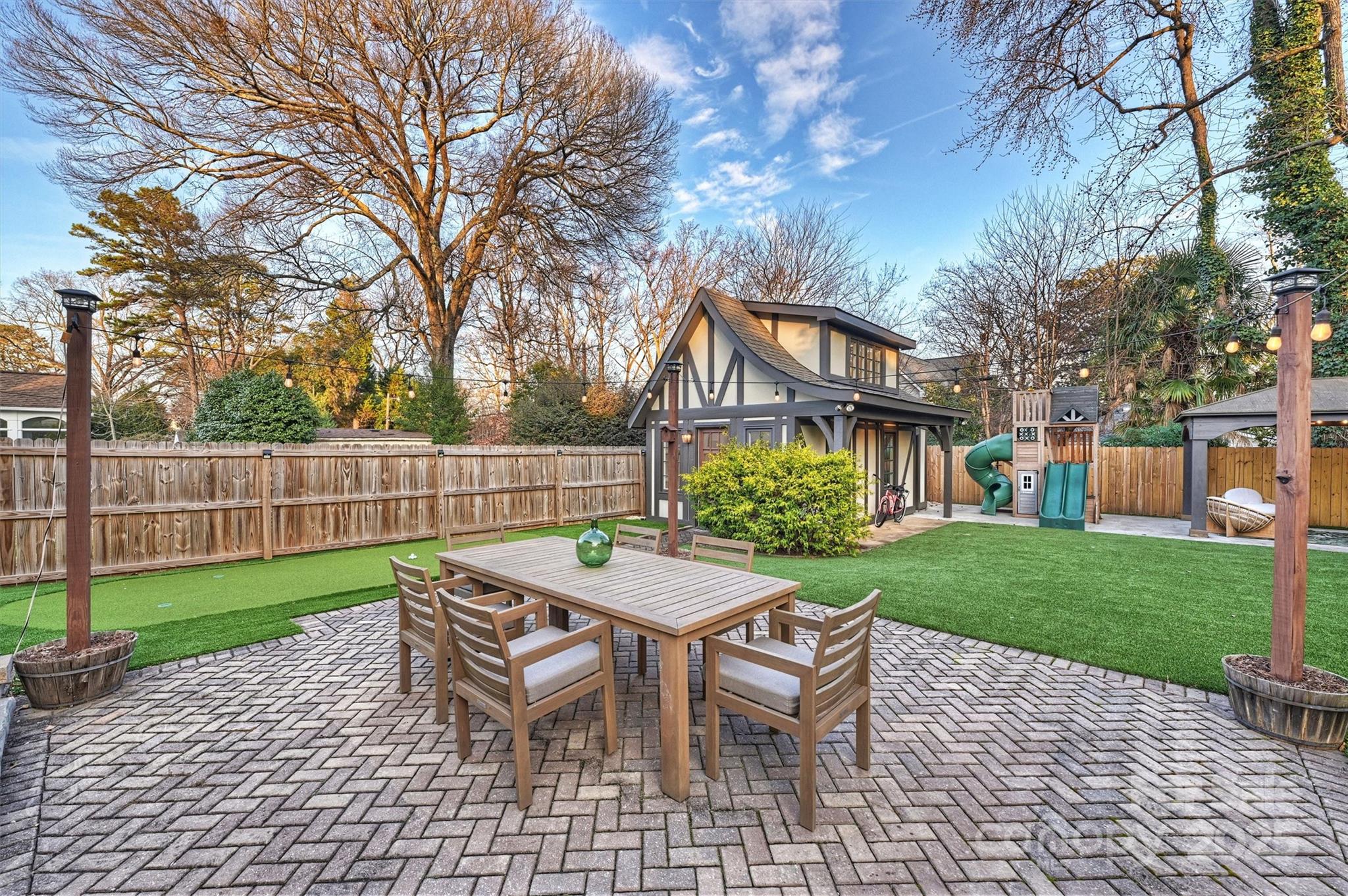 1914 Club Road Charlotte, NC 28205 - Photo 34 of 40 a view of a house with a yard and sitting area