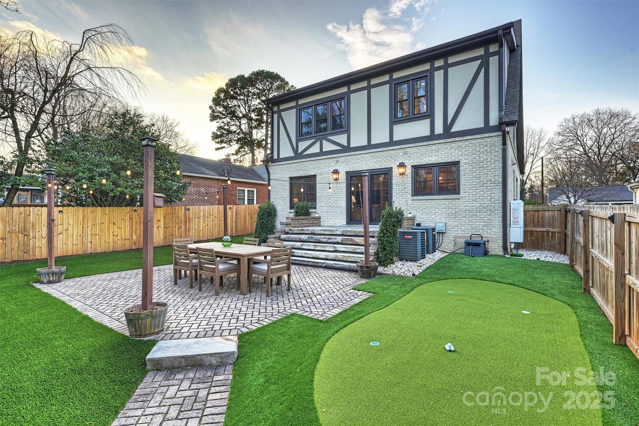 1914 Club Road Charlotte, NC 28205 - Photo 38 of 40 a view of a patio with table and chairs with wooden fence