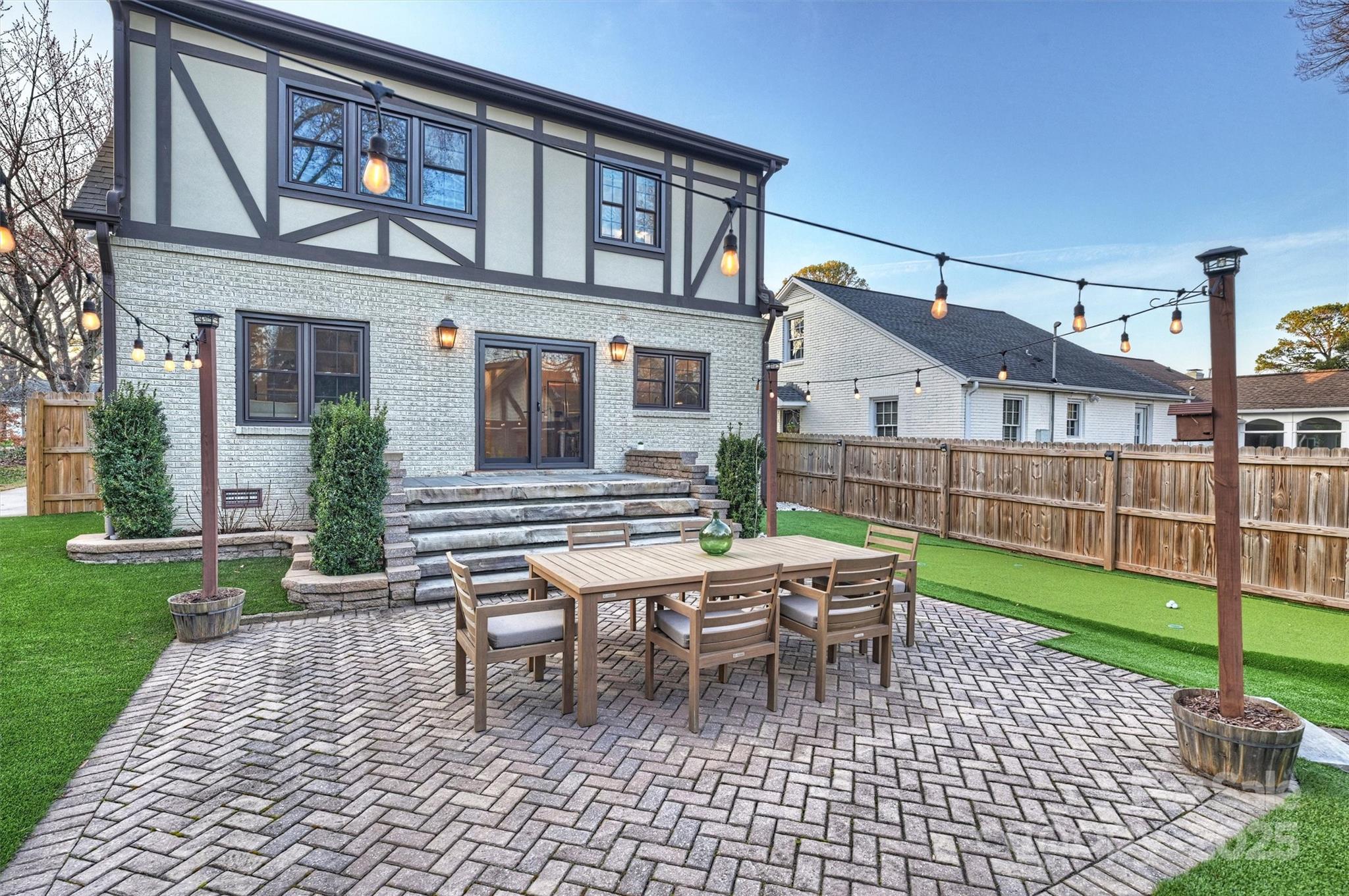 1914 Club Road Charlotte, NC 28205 - Photo 39 of 40 a backyard of a house with barbeque oven table and chairs