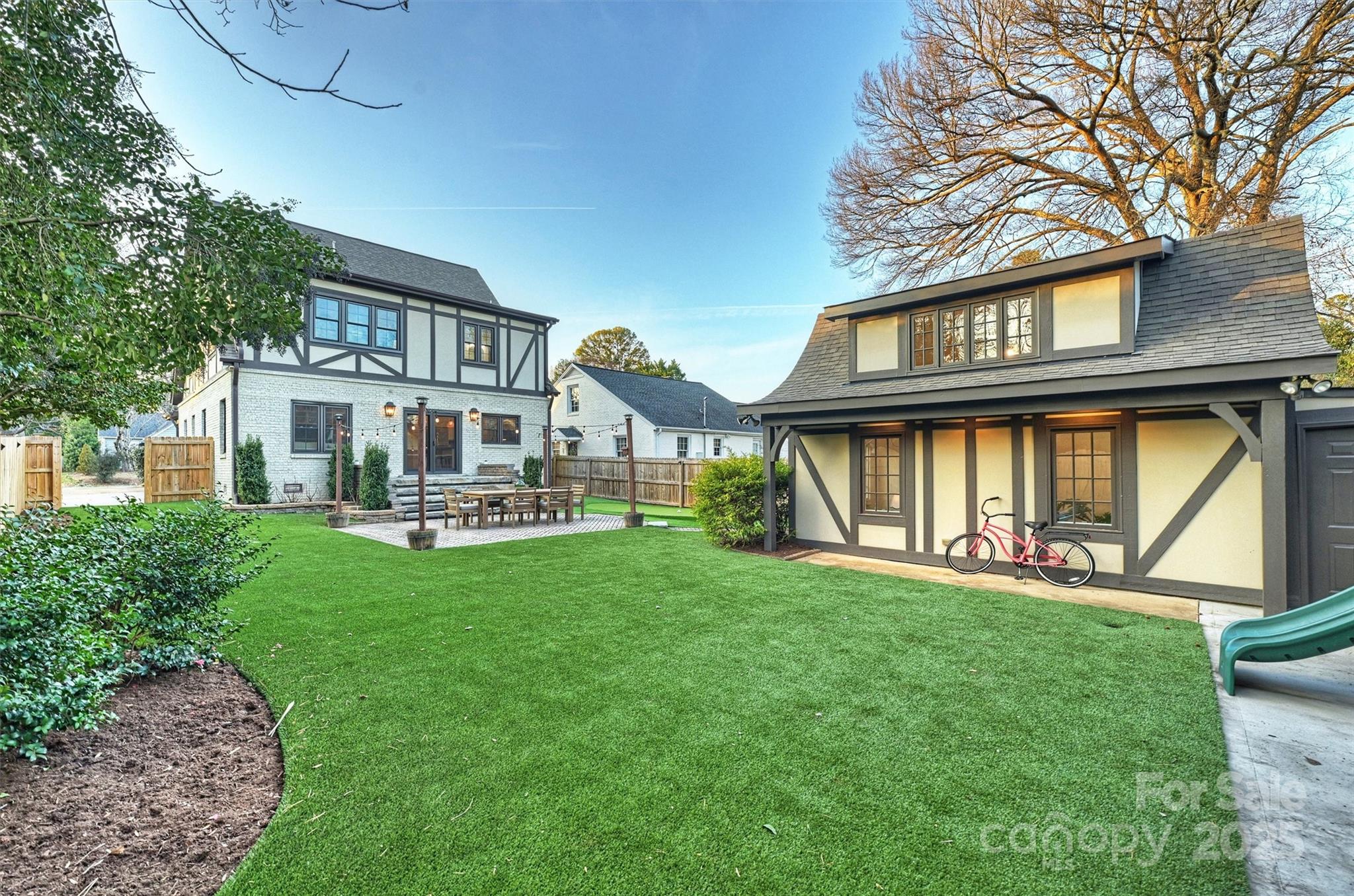 1914 Club Road Charlotte, NC 28205 - Photo 40 of 40 a front view of a house with a yard table and chairs