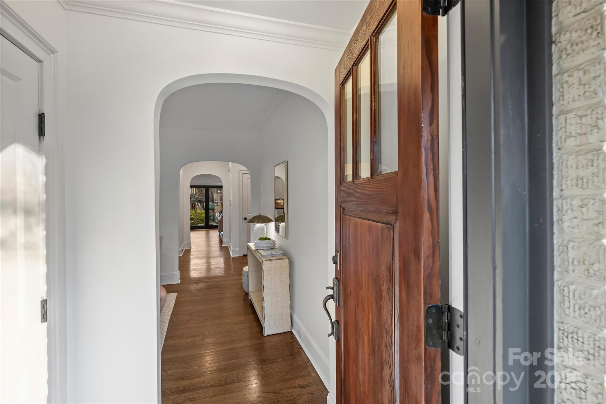1914 Club Road Charlotte, NC 28205 - Photo 6 of 40 a view of a hallway with wooden floor and staircase