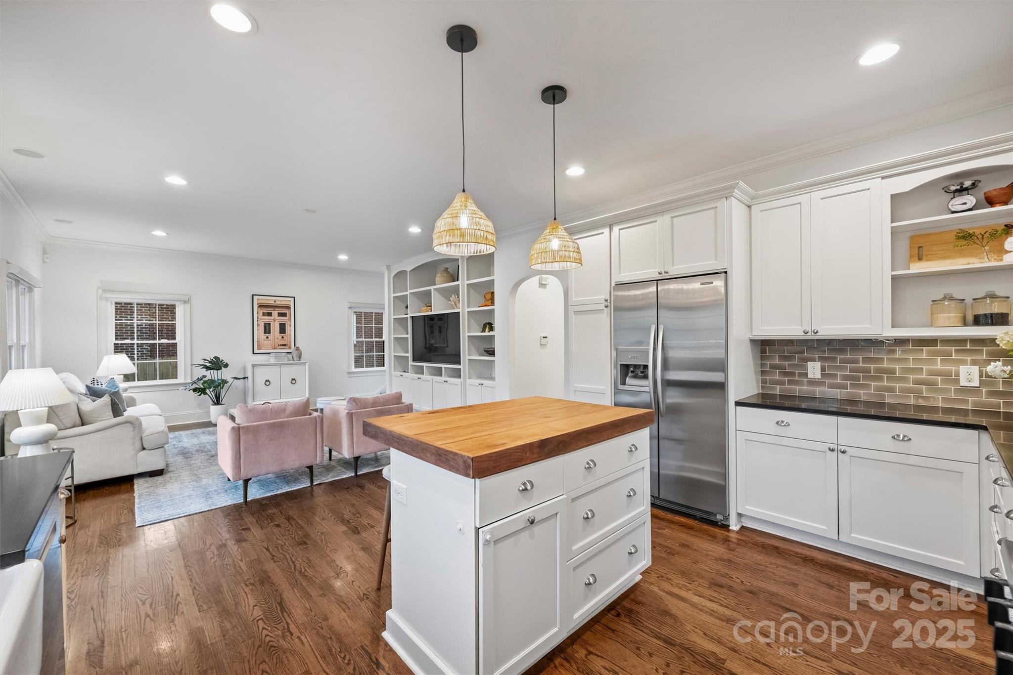 1914 Club Road Charlotte, NC 28205 - Photo 10 of 40 a kitchen with a sink stove and wooden floor