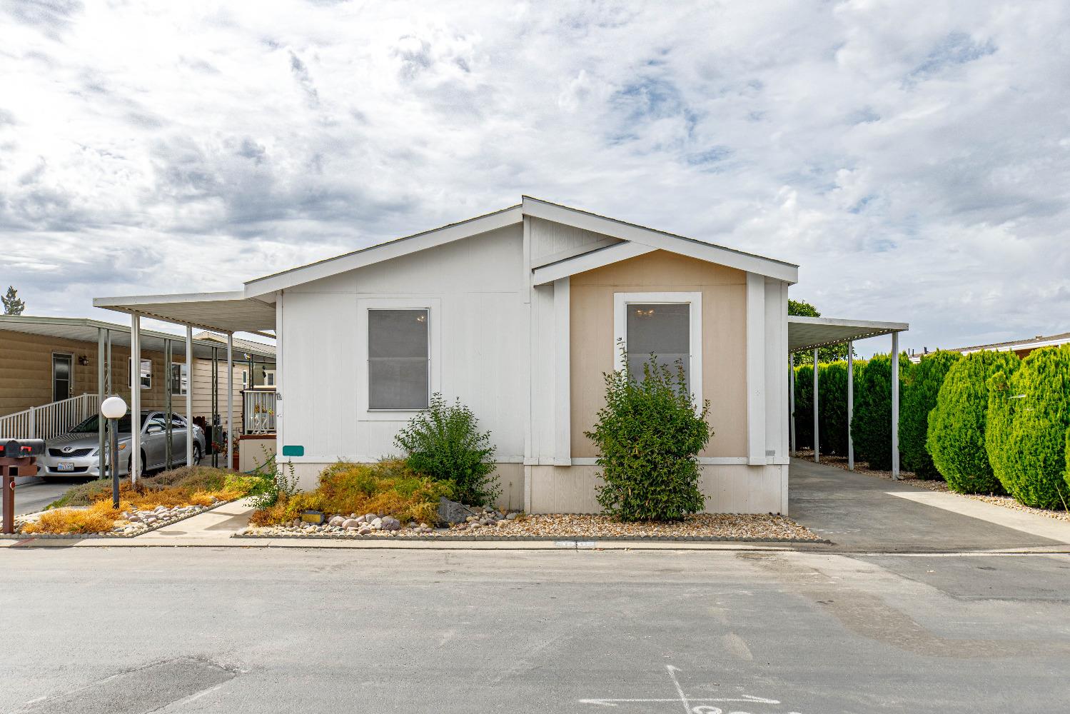 3905 Moana Way, Unit 33 Modesto, CA 95355 - Photo 1 of 1 a view of a house with sitting area and garden