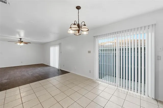 a view of a livingroom with a chandelier fan