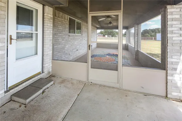a view of an empty room with a glass door