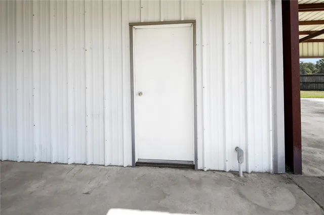 a view of a garage with cars