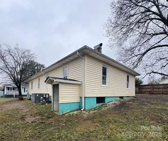 a front view of house with yard and trees