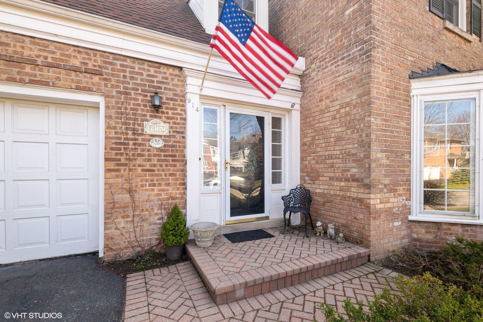 914 Cherokee Road Wilmette, IL 60091 - Photo 2 of 24 a front view of a house with a yard