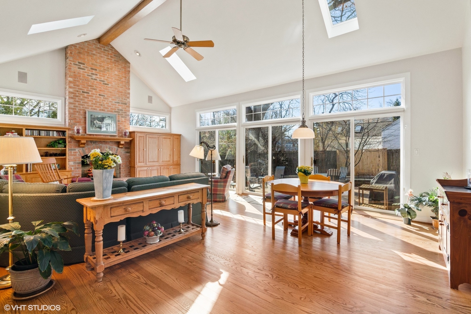 914 Cherokee Road Wilmette, IL 60091 - Photo 11 of 24 a living room with furniture a fireplace and a floor to ceiling window