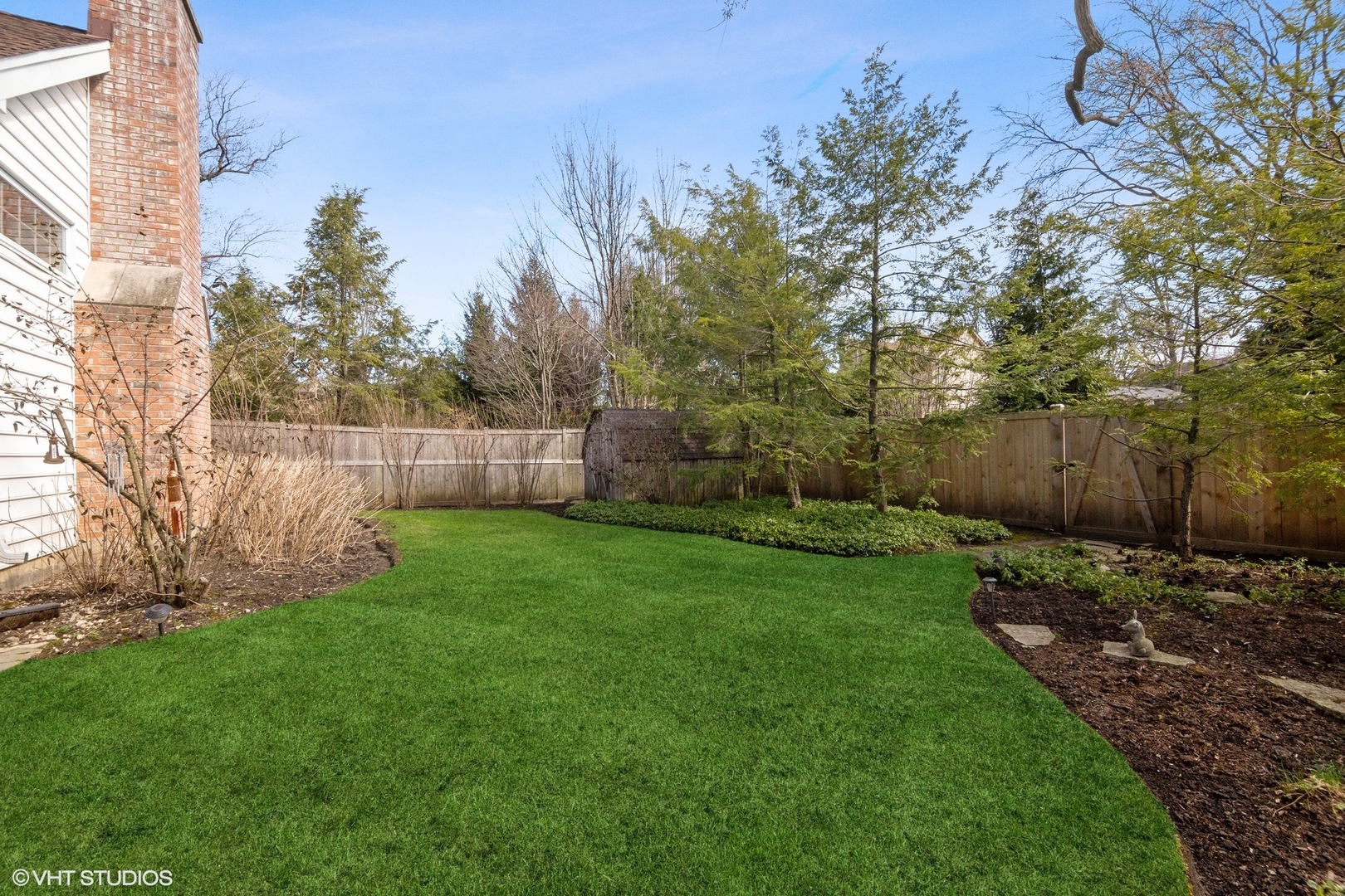 914 Cherokee Road Wilmette, IL 60091 - Photo 20 of 24 a view of a backyard with large trees