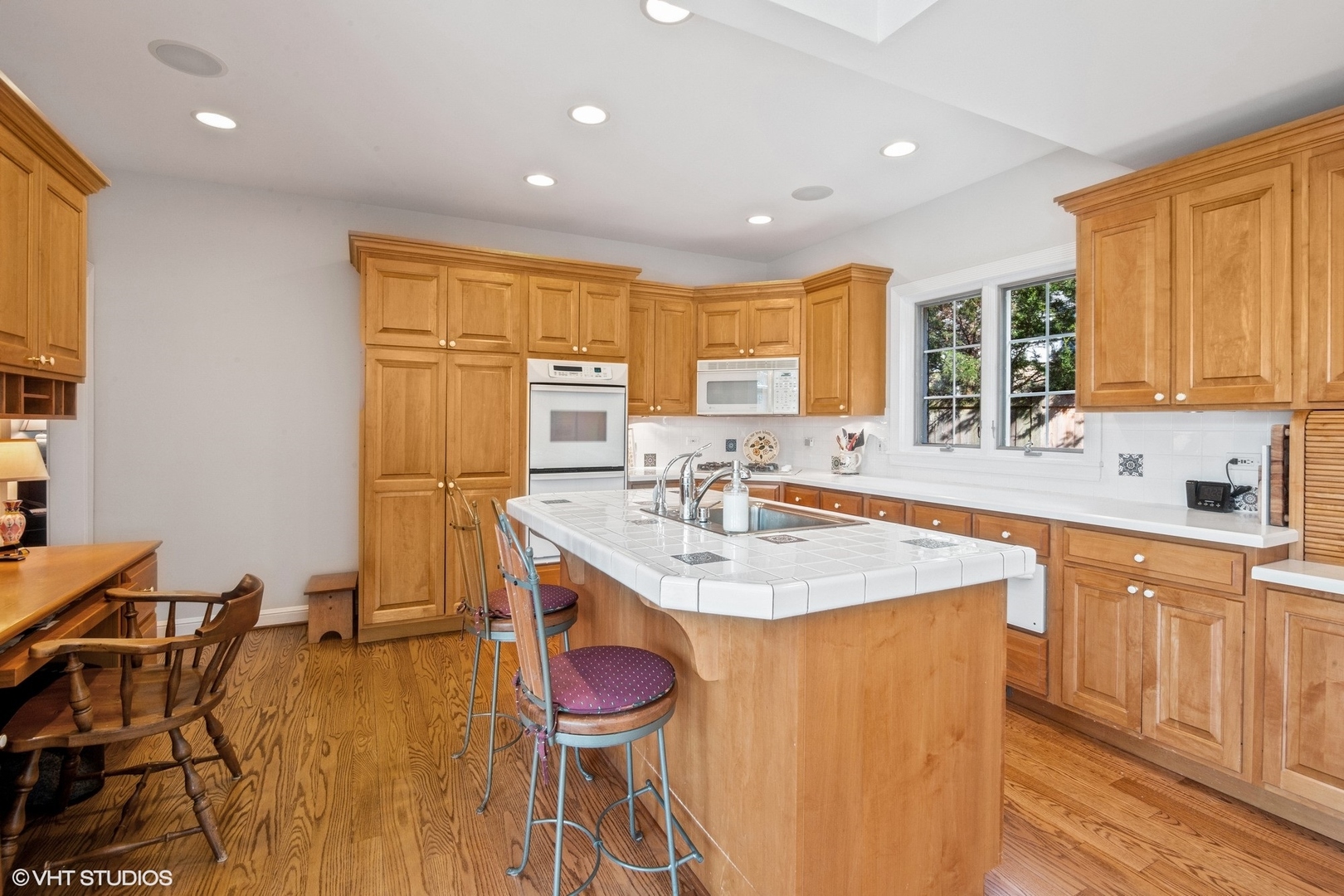 914 Cherokee Road Wilmette, IL 60091 - Photo 9 of 24 a kitchen with a sink cabinets and window