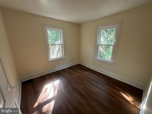 2185 Welsh Road Mohnton, PA 19540 - Photo 19 of 21 an empty room with wooden floor and windows