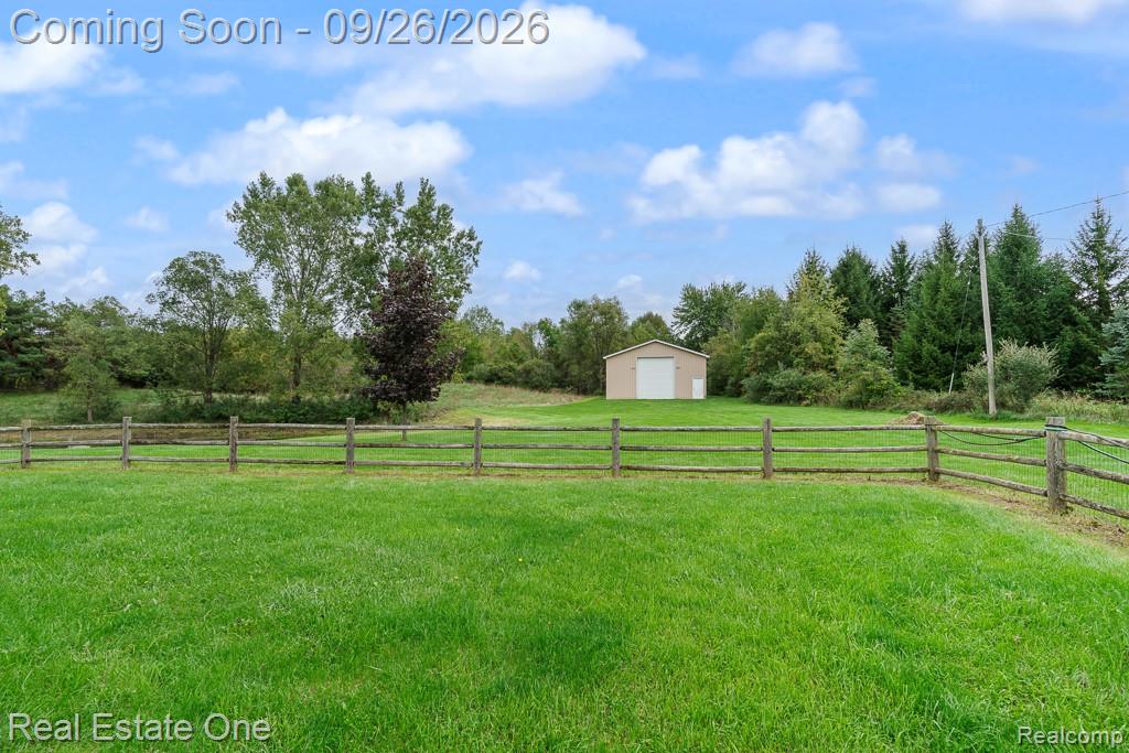 11095 Hogan Road Gaines, MI 48436 - Photo 5 of 47 Fenced in area off the house perfect for your furry friends