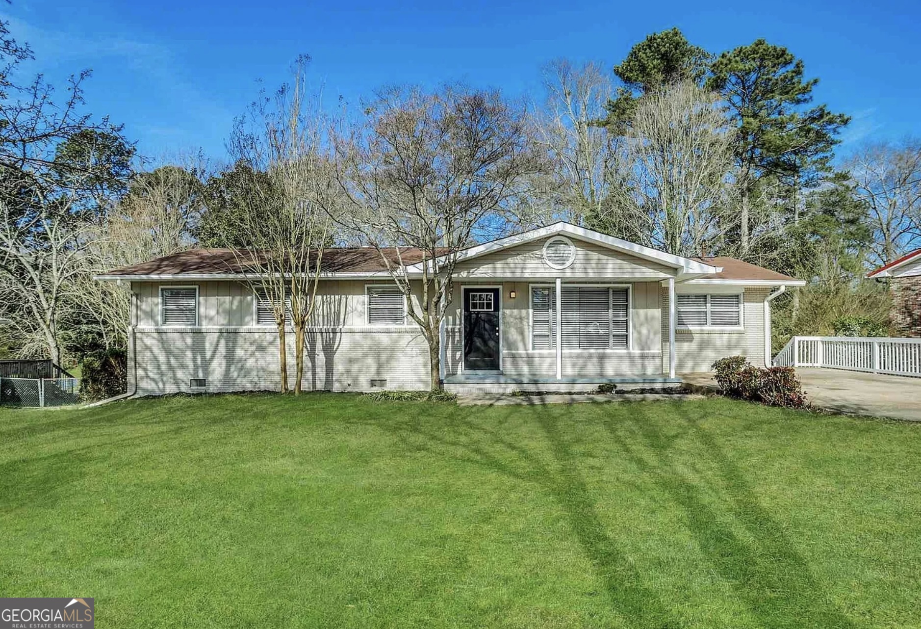 4385 Midway Road Douglasville, GA 30134 - Photo 1 of 12 a front view of a house with a garden