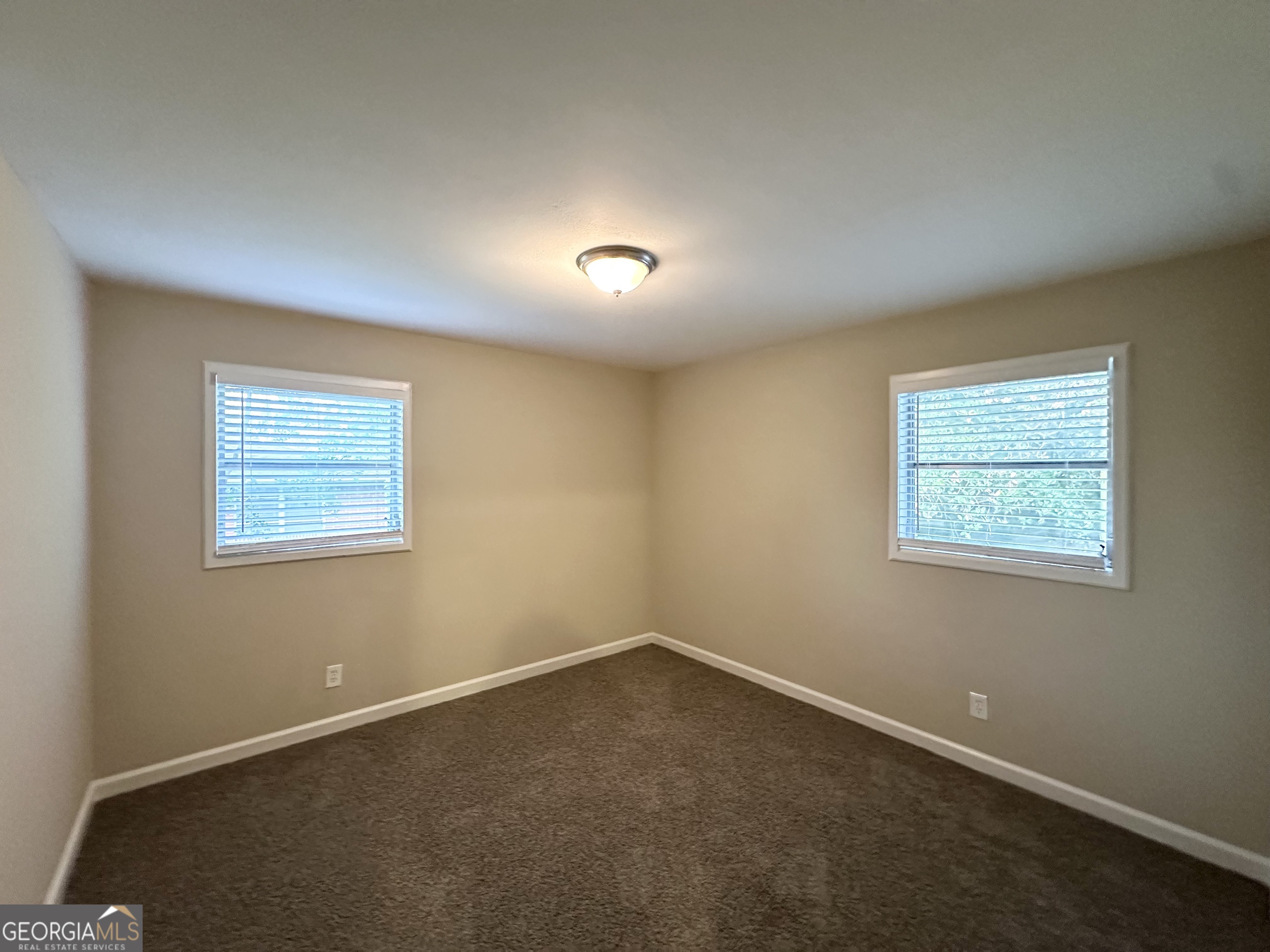 4385 Midway Road Douglasville, GA 30134 - Photo 7 of 12 an empty room with a window