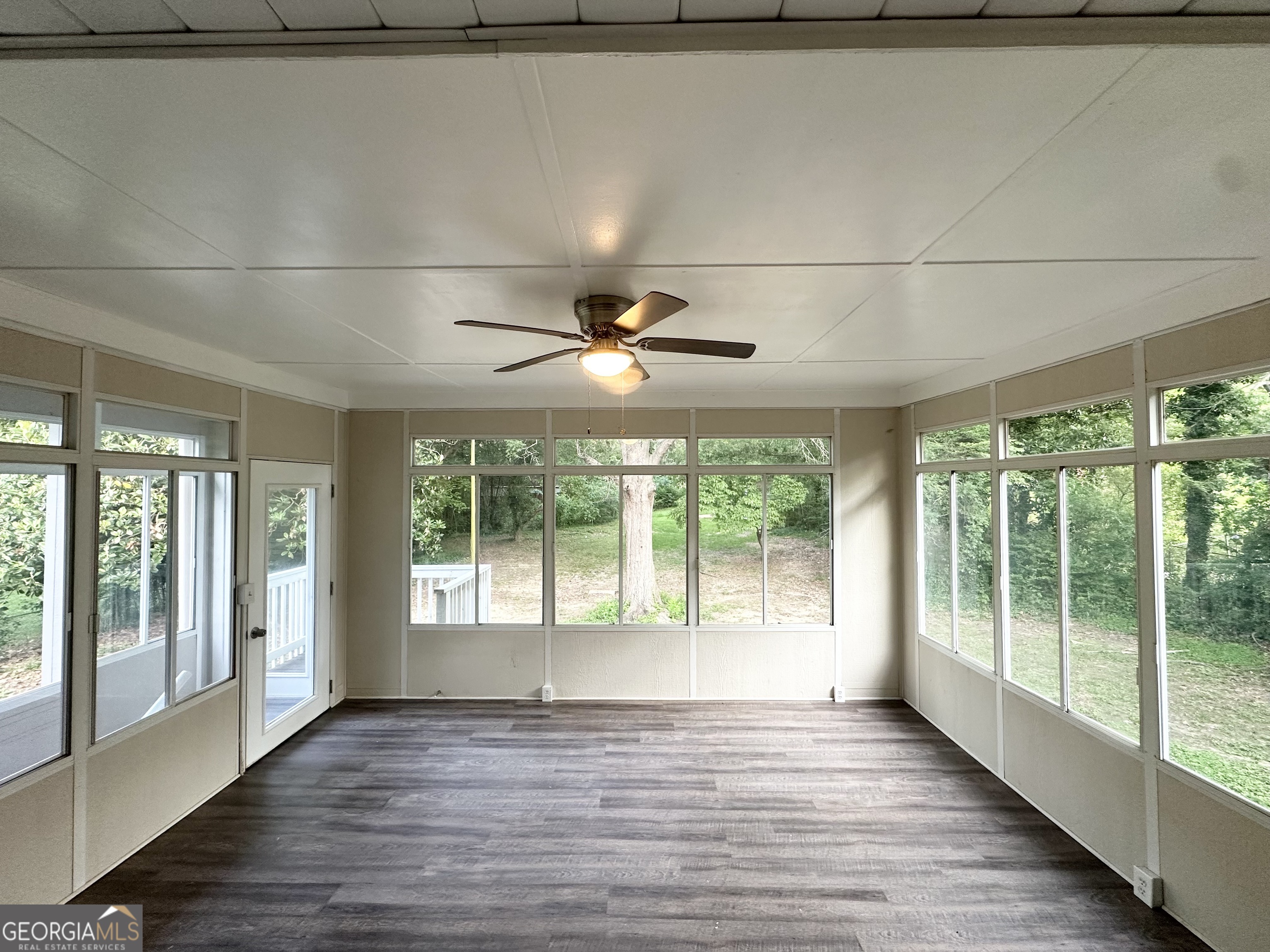4385 Midway Road Douglasville, GA 30134 - Photo 10 of 12 a view of an empty room with wooden floor and a window