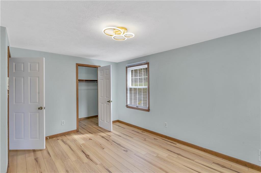 1792 McClure Road Monroeville, PA 15146 - Photo 24 of 41 Bedroom with a walk-in closet and new flooring installed in 2026.