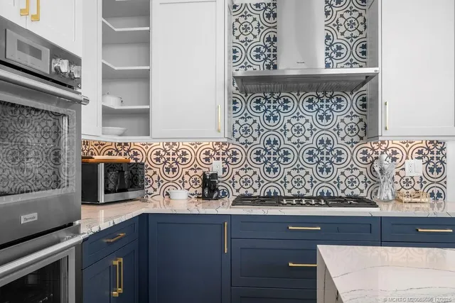 a living room with furniture a table and a chandelier