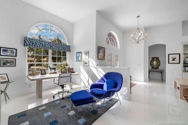 a spacious bathroom with a granite countertop sink and a mirror