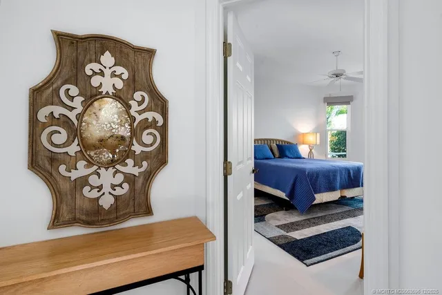 a bedroom with two beds and windows