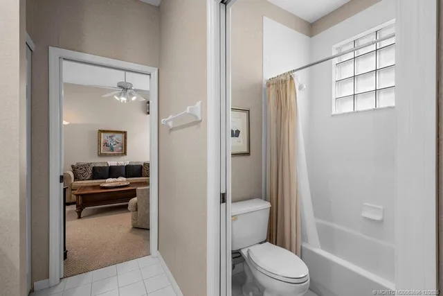 an aerial view of a houses with yard and swimming pool