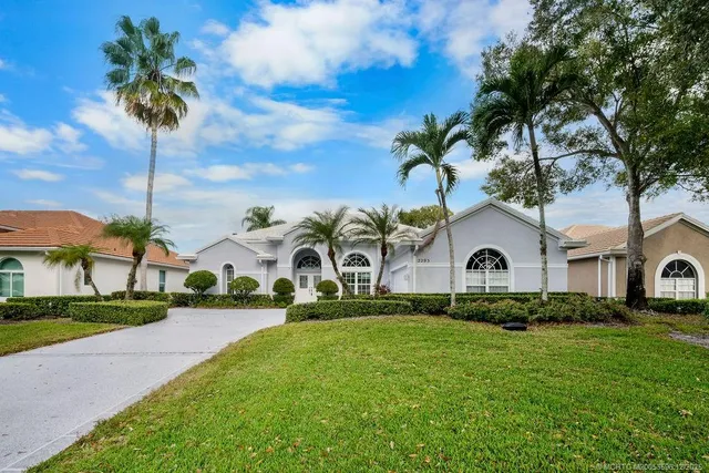 a front view of house with yard and green space