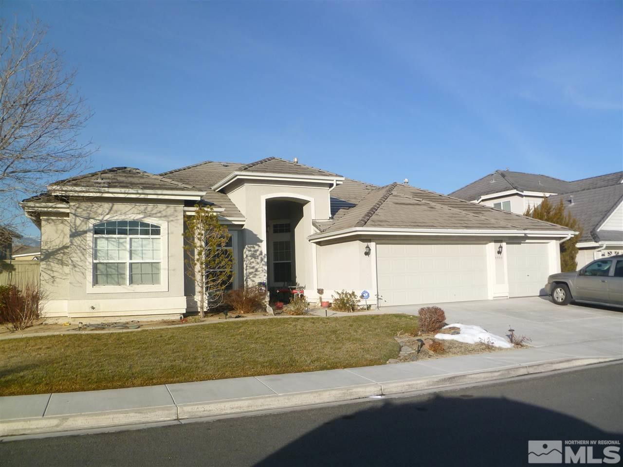 9925 Bandana Way Reno, NV 89521 - Photo 1 of 1 a front view of a house with a yard