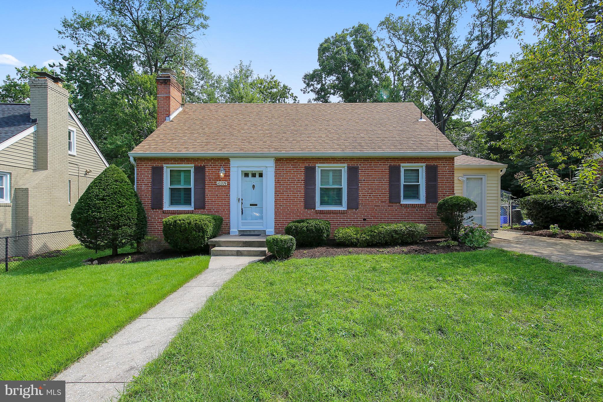 10209 Carson Place Silver Spring, MD 20901 - Photo 1 of 27 a front view of house with yard and green space
