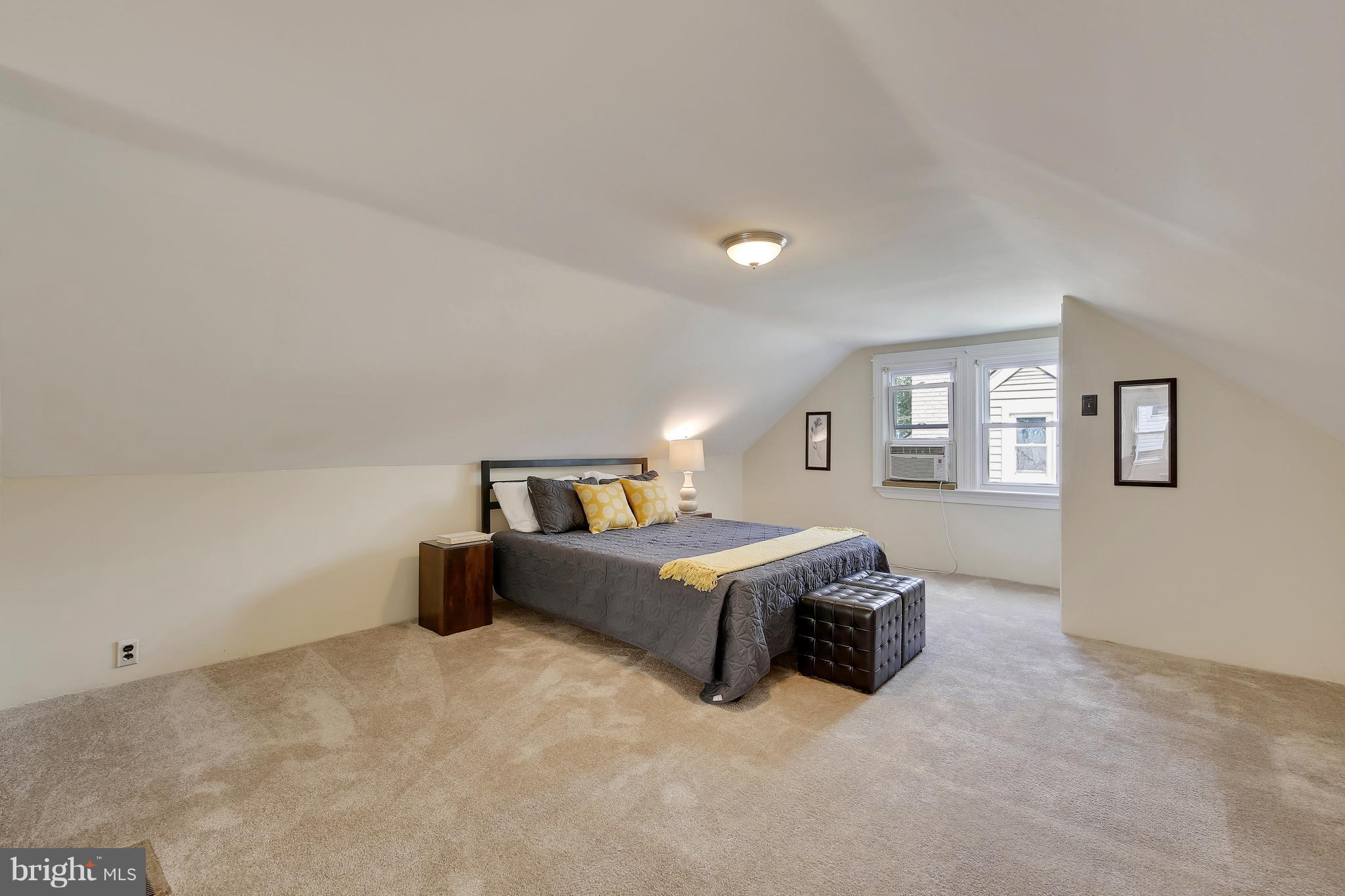 10209 Carson Place Silver Spring, MD 20901 - Photo 16 of 27 a living room with a bed furniture and a window