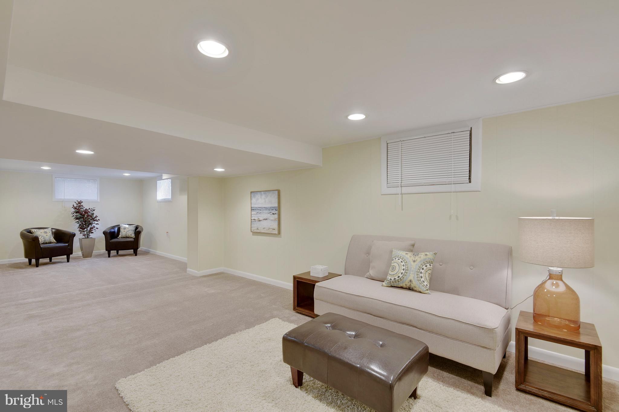 10209 Carson Place Silver Spring, MD 20901 - Photo 21 of 27 a bedroom with furniture and a lamp