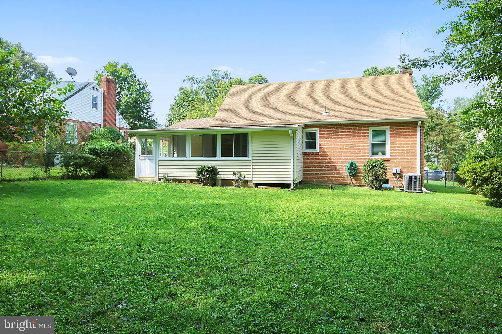 10209 Carson Place Silver Spring, MD 20901 - Photo 24 of 27 a front view of house with yard and green space