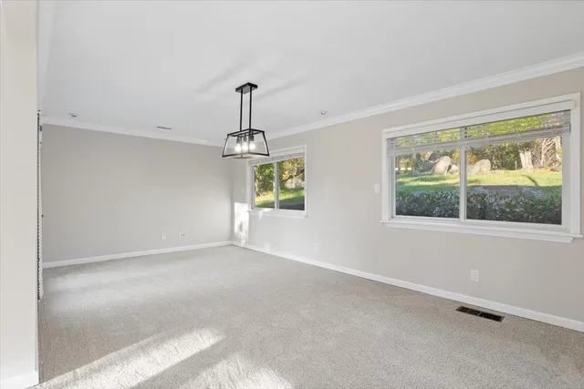a kitchen with granite countertop a sink and cabinets