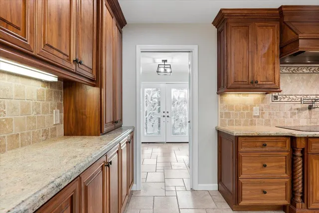 a view of a livingroom with a ceiling fan & a window