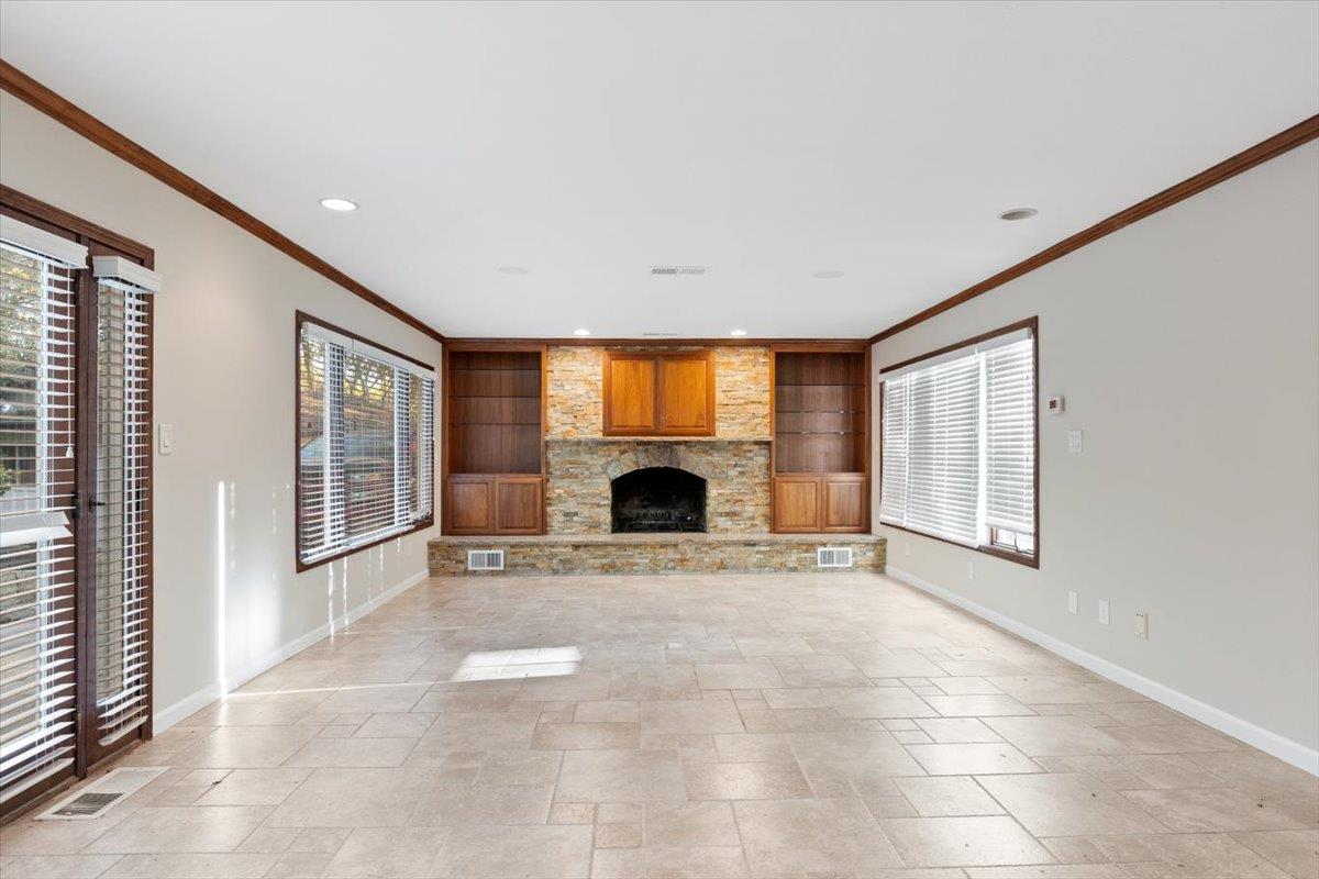 8501 King Road Loomis, CA 95650 - Photo 22 of 89 a view of an empty room with a fireplace and a window