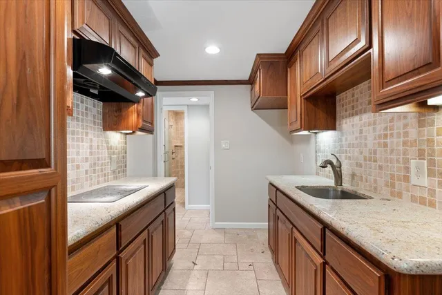a bathroom with a toilet a sink and shower
