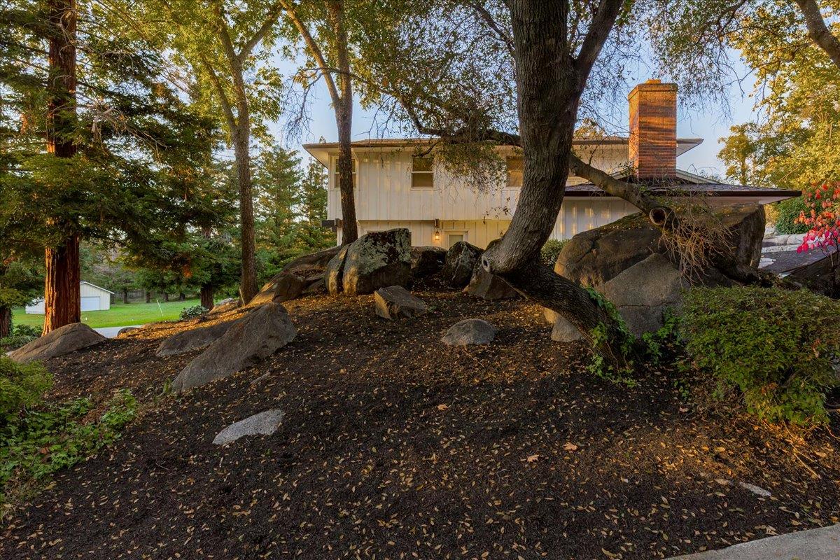 8501 King Road Loomis, CA 95650 - Photo 75 of 89 a backyard of a house with barbeque oven table and chairs