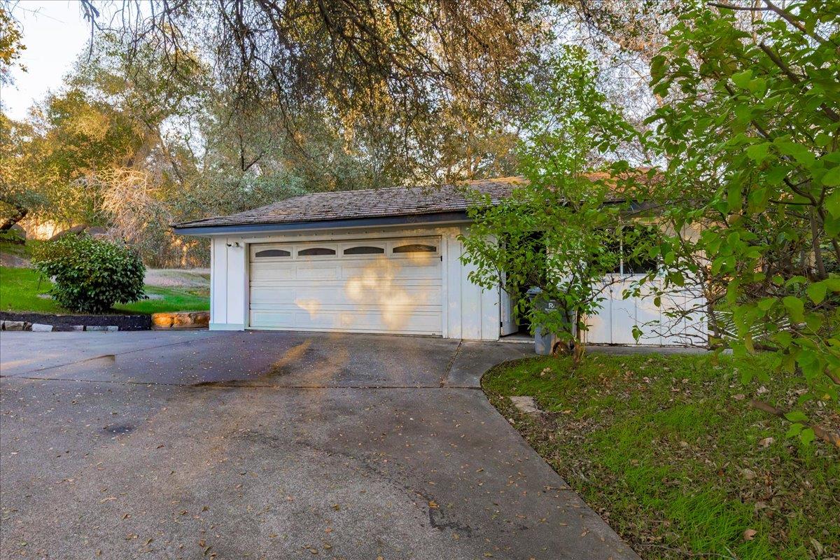 8501 King Road Loomis, CA 95650 - Photo 77 of 89 a front view of a house with a yard and garage